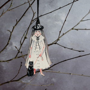 White witch with her black cat, hanging decoration. Made from laser cut wood. Halloween decor