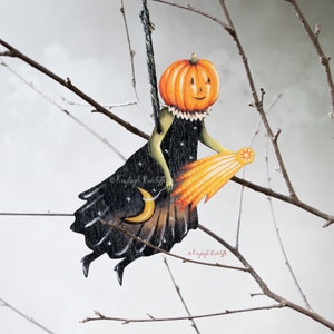 Wooden Halloween pumpkin figure with a shooting star hanging ornament. Double sided. Retro style Halloween decor. "Freida" the pumpkin