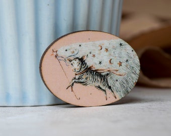 Wooden badge pin of a sheep with magical stars. Laser cut from wood, made within the UK. Vintage style design