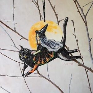 Witch on a leaping cat wooden Halloween ornament. Vintage style, designed and made in the UK.