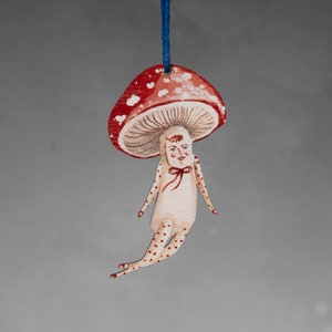 Double sided mushroom hanging decoration, made from wood. Wilder the mushroom man