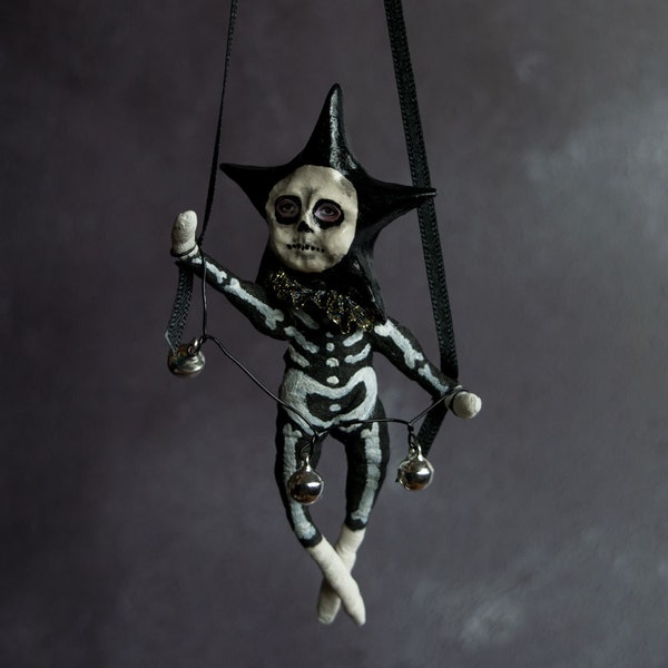 Eddie the black star man in his Halloween skeleton outfit. Macabre/ dark art/ gothic. Halloween skeleton. Halloween hanging tree decoration