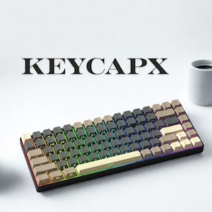 May include: A mechanical keyboard with a black frame and a variety of keycap colors, including gray, beige, and white. The keys are backlit with a rainbow gradient. The word "KEYCAPX" is printed above the keyboard.