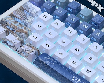 Teclas coreanas – Juego de PBT azul y blanco translúcido, perfil Cherry, con texto en inglés impreso en el lateral.