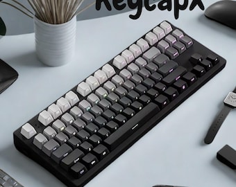 Teclas retroiluminadas en negro y gris con impresión lateral – Perfil OEM PBT de doble inyección con brillo RGB