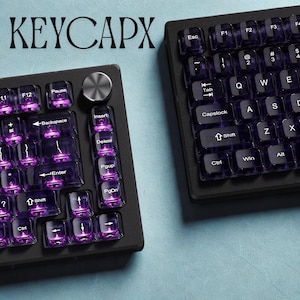 RGB illuminated transparent purple keycaps gaming setup