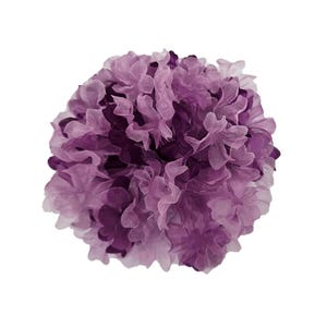May include: A large, purple tissue paper pom pom. The pom pom is made of many layers of tissue paper, and it has a fluffy, rounded shape.