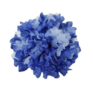 May include: A blue and white pom pom flower made of fabric. The flower is made of layers of fabric that are ruffled and gathered together to create a fluffy, round shape.