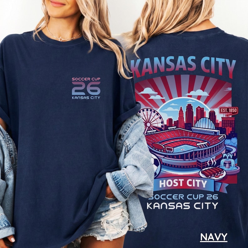 Front and back view of a woman in a navy blue t-shirt showcasing the detailed retro Kansas City Host City design.
