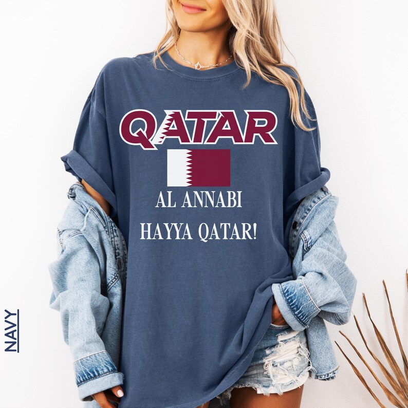 Navy blue T-shirt showcasing the Qatar flag and Al Annabi match day soccer apparel print.