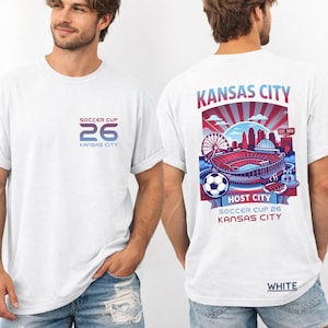 Male model from behind wearing a white relaxed-fit t-shirt to display the full-scale Kansas City stadium and city illustration.