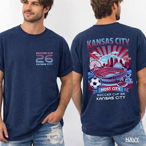 Male model in a navy t-shirt demonstrating the gameday streetwear fit for sports fans.