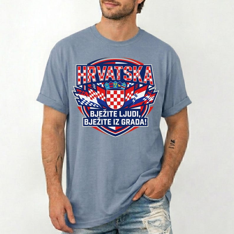 May include: A light blue t-shirt featuring a Croatian emblem with the word "HRVATSKA" in red and white. The emblem includes a checkered shield and the text "BJEŽITE LJUDI, BJEŽITE IZ GRADA!" in white.