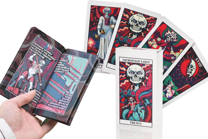 May include: A set of tarot cards with a dark, gothic aesthetic. The cards feature illustrations of skeletons, skulls, and other macabre imagery. The box for the cards is white with black text that reads "Necropolis Tarot" and "The Sun".