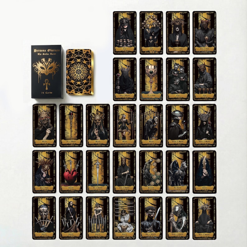 May include: A Persona Obscura The Gothic Tarot deck featuring a black box with gold mask and ankh symbols, a card back with intricate gold patterns, and thirty-two individual tarot cards displaying dark, gothic-themed illustrations with gold borders.