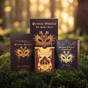 May include: A collection of Persona Obscura card decks and a guidebook. The black boxes feature gold mask illustrations and text including The Gothic Tarot, The Guidebook, Lenormand 36 Cards, and a tan Playing Cards box with a spade symbol.