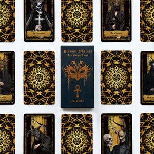 May include: A Persona Obscura The Gothic Tarot deck box with a black cover featuring a gold mask and ankh symbol, surrounded by multiple tarot cards displaying dark, ornate figures and intricate gold geometric patterns on a black background.