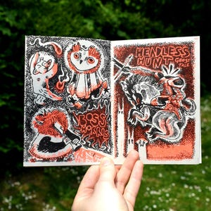 May include: A small, black and white illustrated book with the title "Headless Hunt: Ghost Tale" on the cover. The cover features a black and white illustration of a headless knight riding a horse. The book has a red and white dotted background.