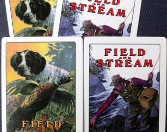 May include: Four vintage playing cards with white borders. Two cards feature a hunting dog and a pheasant, with "FIELD AND STREAM" text. The other two cards show a fisherman in a stream, also with the text "FIELD AND STREAM".