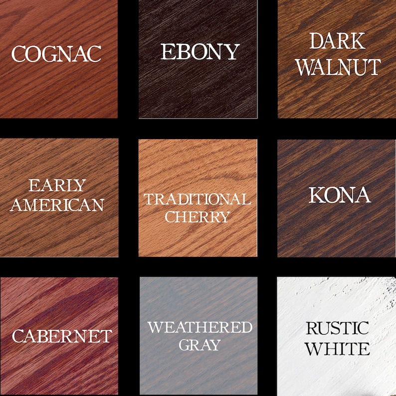 May include: Nine wood stain samples are displayed, each with a different colour name. The colours are Cognac, Ebony, Dark Walnut, Early American, Traditional Cherry, Kona, Cabernet, Weathered Grey, and Rustic White.
