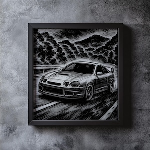 May include: Black and white framed print of a sports car speeding on a road. The artwork depicts the car in motion with a mountain and tree-filled background. The car has a spoiler and is set against a textured, dark background.