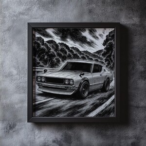 May include: Black and white framed print of a classic car speeding down a road. The artwork depicts a vintage coupe with a detailed illustration style, set against a backdrop of trees and a cloudy sky. The print is encased in a black frame.