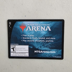 May include: A black and blue Magic The Gathering Arena card. The card features the Arena logo, text that reads "Free to play", and "Play anyone, anywhere, anytime". The card also includes the ESRB rating and the website MTGArena.com.