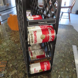 Two soup can dispensers stacked together