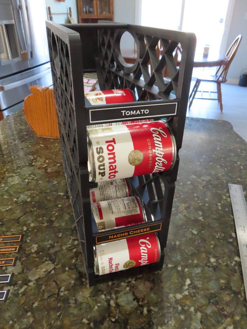 Two soup can dispensers stacked together