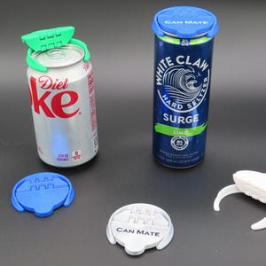 May include: Image of several can lids and can toppers. Two cans are shown, one Diet Coke and one White Claw Hard Seltzer. The can toppers are green, white, and blue. The lids are blue and white, with the text "CAN MATE".