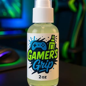 May include: A clear plastic spray bottle with a white label. The label has a green and blue design with the text "GAMER'S Grip" and "2 oz".