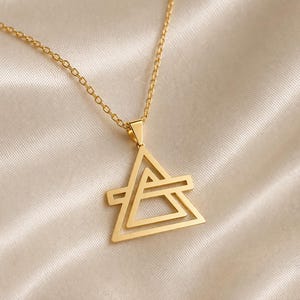 May include: A set of three ceramic mugs with a speckled, matte finish. Each mug features a different color: light blue, cream, and gray. The mugs have a simple, modern design and a comfortable handle.