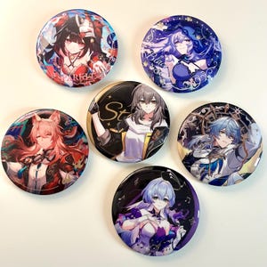 May include: Six round pinback buttons featuring anime characters with colorful backgrounds. The buttons feature a variety of characters with different hairstyles, clothing, and poses. The text "Starlight" is visible on one of the buttons.