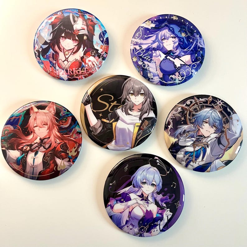 May include: Six round pinback buttons featuring anime characters with colorful backgrounds. The buttons feature a variety of characters with different hairstyles, clothing, and poses. The text "Starlight" is visible on one of the buttons.
