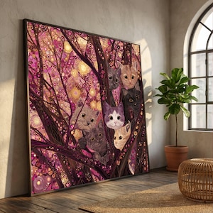 May include: A framed art print featuring a whimsical illustration of several cats nestled among stylized, abstract trees. The artwork is dominated by shades of pink, purple, and brown, with a touch of gold. The cats have various fur colors.