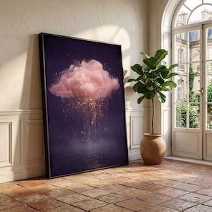 May include: A framed art print featuring a pink cloud with golden sparkles against a dark purple background. The artwork is displayed in a room with a plant in a terracotta pot and a large window.