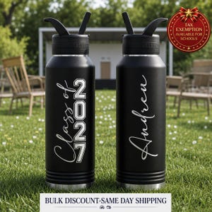 May include: Two matte black stainless steel water bottles with black lids and straws. One bottle features the white text Class of 2027 in a mix of script and block fonts. The other bottle displays the white script name Andrew vertically.