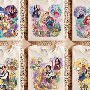 May include: Six off-white t-shirts featuring watercolour-style illustrations of Disney couples arranged in Mickey Mouse head silhouettes. Each shirt displays characters from Aladdin, Sleeping Beauty, The Little Mermaid, Snow White, Tangled, and Beauty and the Beast.