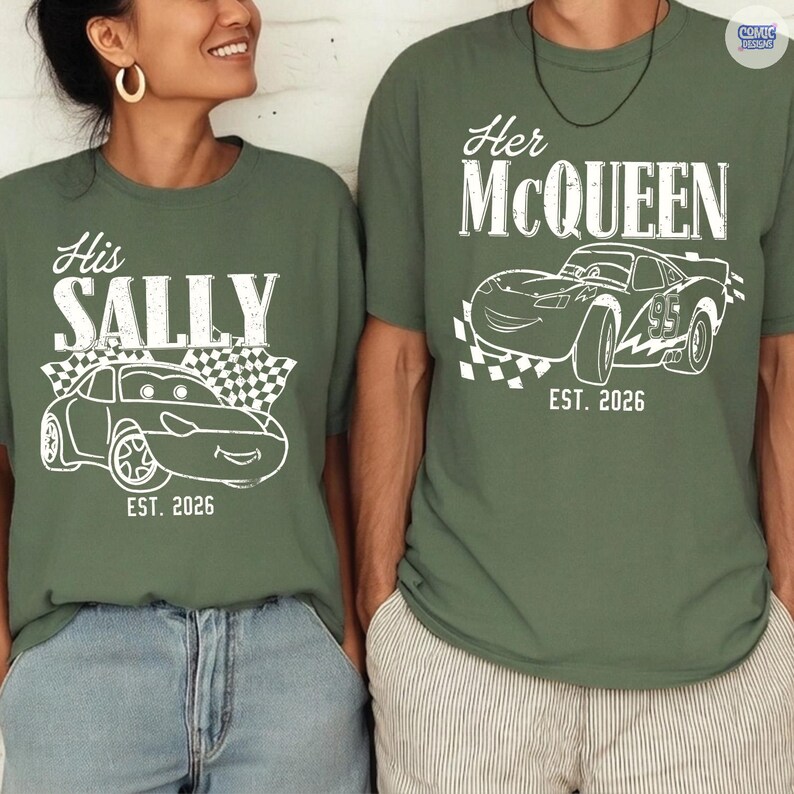 May include: Two olive green t-shirts with white graphics. One says "His SALLY" with a car illustration and "EST. 2026". The other says "Her McQUEEN" with a car illustration and "EST. 2026".
