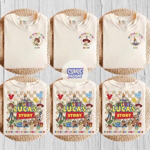 May include: Six cream-coloured t-shirts. The top row features "Birthday Girl" designs with cartoon characters. The bottom row displays "Lucas's Story" designs with multiple characters and text. The shirts are arranged on woven mats.