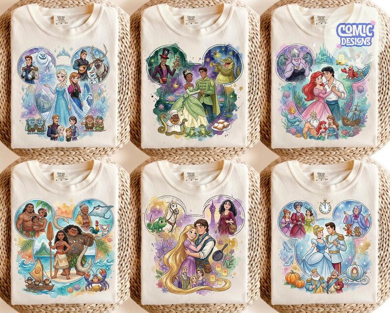 May include: A collection of six off-white t-shirts featuring watercolour-style illustrations of Disney characters arranged in Mickey Mouse ear shapes. Each shirt displays scenes from movies like Frozen, The Princess and the Frog, The Little Mermaid, Moana, Tangled, and Cinderella, with the text Comic Designs in the top right corner.