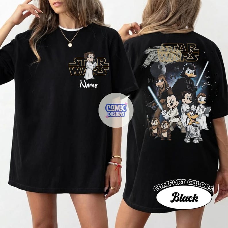 May include: Black t-shirt featuring a Star Wars and Disney mashup design. The front displays a character with the text "Star Wars" and "Name". The back showcases various characters, the Millennium Falcon, and the text "Star Wars".