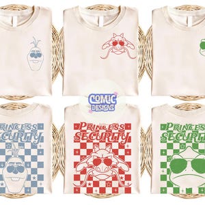 May include: Cream-colored t-shirts with various cartoon character designs. Some shirts feature a character's face, while others display the text "PRINCESS SECURITY" with a matching character graphic. The designs include a snowman, a dragon, and a frog.