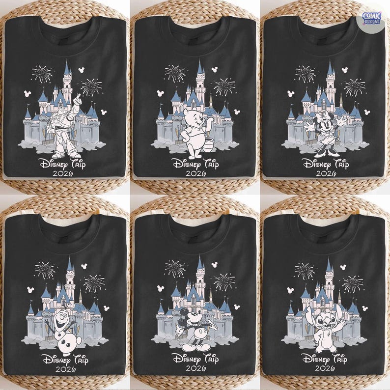 May include: Six black t-shirts featuring Disney characters and the text "Disney Trip 2026". Each shirt displays a different character in front of a castle with fireworks. Characters include Buzz Lightyear, Winnie the Pooh, Minnie Mouse, Olaf, Mickey Mouse, and Stitch.