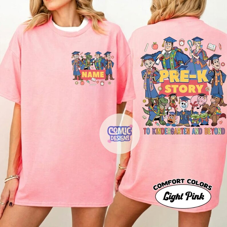 May include: Light pink t-shirt with a cartoon graphic. The front features a group of cartoon characters with the word "NAME" above them. The back has the words "PRE-K STORY" and "TO KINDERGARTEN AND BEYOND" with more cartoon characters. The shirt is labeled "COMFORT COLORS Light Pink".