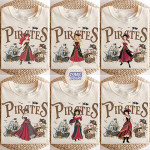 May include: Cream-colored t-shirts with a "Pirates" graphic featuring various cartoon female characters in pirate attire. The design includes a pirate ship, treasure chest, and a ship's wheel. The text "Comic Designs" is also visible.