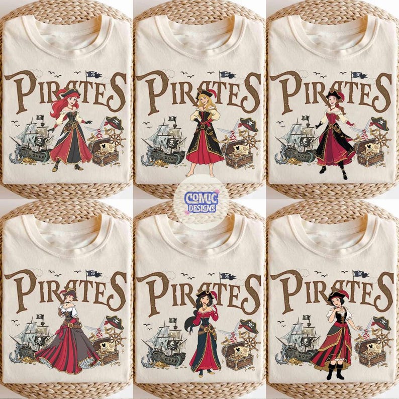 May include: Cream-colored t-shirts with a "Pirates" graphic featuring various cartoon female characters in pirate attire. The design includes a pirate ship, treasure chest, and a ship's wheel. The text "Comic Designs" is also visible.