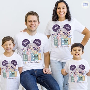 May include: White t-shirts with a colorful graphic featuring Disney characters, the text "EPC", and the year "2026". Each shirt has a name and the words "The Smith Family". The shirts are worn by a family of four.