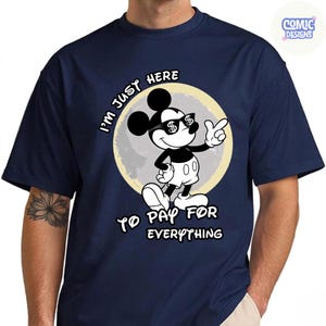 May include: Navy blue t-shirt featuring a cartoon Mickey Mouse character wearing sunglasses with dollar signs. The text on the shirt reads "I'm just here to pay for everything."