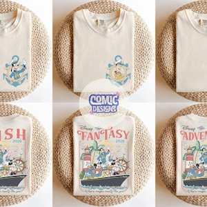 May include: Cream-colored t-shirts with Disney character designs. The top row features shirts with an anchor design and Mickey Mouse, Goofy, and Donald Duck. The bottom row displays shirts with a cruise ship graphic and the words "WISH", "FANTASY", and "ADVENTURE".